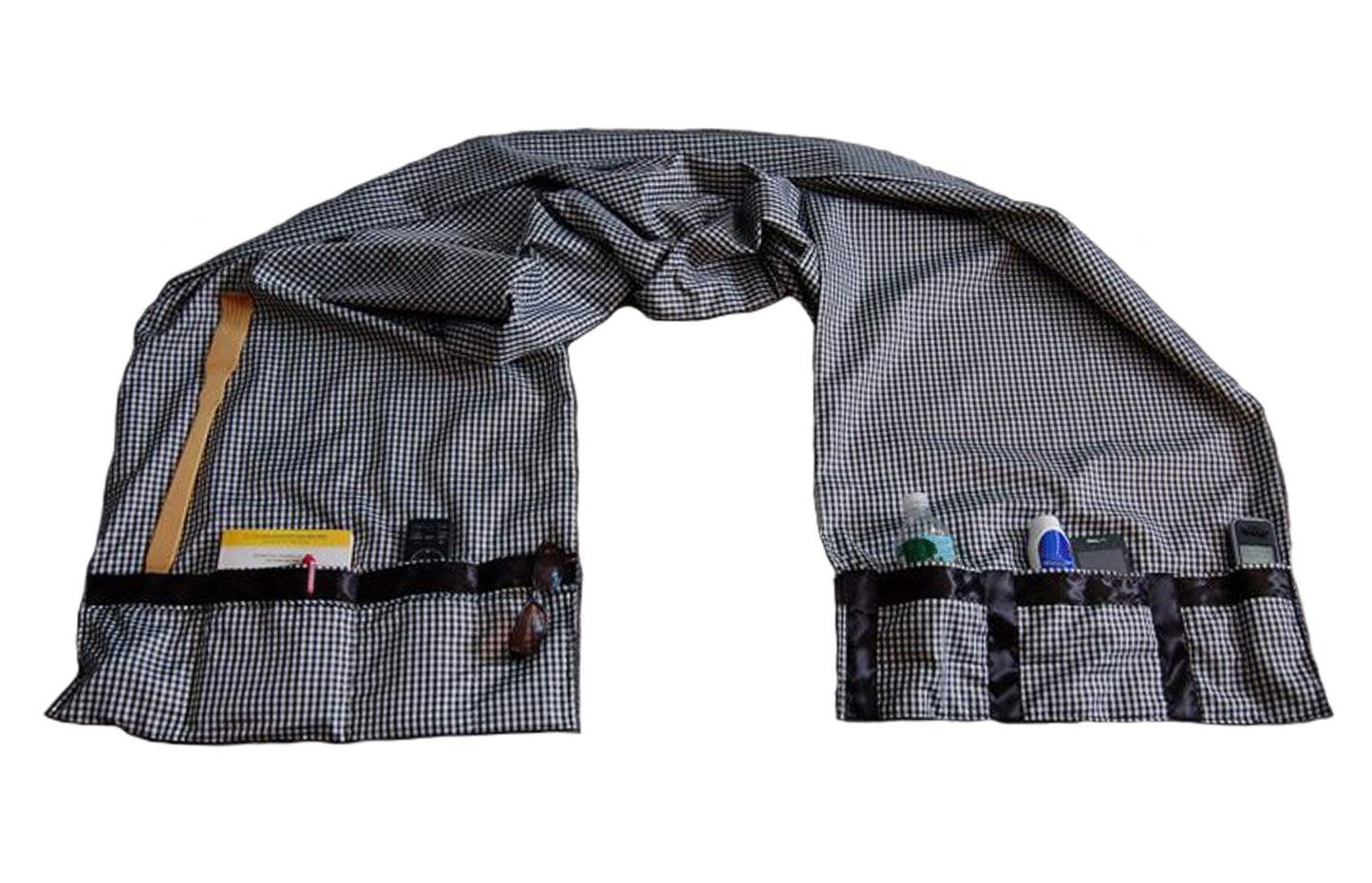 McNair D.B.B. Bedside Storage Organizer/Caddy extends from the left side of the bed to the right side. It provides easy access to remote controls, eye glasses, books, cell phones, water bottles, etc.